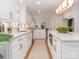 Modern kitchen with white cabinets, marble countertops, and large island at 4342 Arborway None, Charlotte, NC 28211