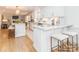 Modern kitchen with white cabinets, marble countertops, and large island at 4342 Arborway None, Charlotte, NC 28211