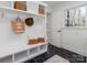 Mudroom with built-in bench, shelving, and hexagon tile floor at 4342 Arborway None, Charlotte, NC 28211