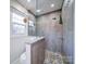 Walk-in shower with pebble floor and glass enclosure at 4440 Beechaven Dr, Rock Hill, SC 29732