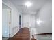 Upstairs hallway with wood flooring and access to bedrooms at 4440 Beechaven Dr, Rock Hill, SC 29732