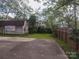 Large backyard with shed and wooden fence at 523 W 2Nd Ave, Gastonia, NC 28052