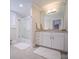 Bathroom with glass shower, granite vanity and white cabinets at 523 W 2Nd Ave, Gastonia, NC 28052