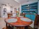 Kitchen dining area with wood table and four chairs at 523 W 2Nd Ave, Gastonia, NC 28052