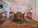 Formal dining room featuring hardwood floors and chandelier at 523 W 2Nd Ave, Gastonia, NC 28052