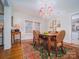 Bright dining room with hardwood floors and chandelier at 523 W 2Nd Ave, Gastonia, NC 28052