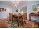 Elegant dining room with hardwood floors and chandelier at 523 W 2Nd Ave, Gastonia, NC 28052