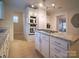 Modern kitchen with granite countertops and white cabinets at 523 W 2Nd Ave, Gastonia, NC 28052