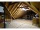 Unfinished attic space with shelving and storage boxes at 5375 Josephine Sw Ln, Concord, NC 28027