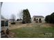 Grass backyard with a sunroom and wooden fence at 5375 Josephine Sw Ln, Concord, NC 28027