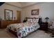 Main bedroom with dresser, rocking chair, and ensuite at 5375 Josephine Sw Ln, Concord, NC 28027