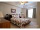 Main bedroom with cozy bedding and window view at 5375 Josephine Sw Ln, Concord, NC 28027