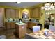 Kitchen with light wood cabinets, an island, and a breakfast nook at 5375 Josephine Sw Ln, Concord, NC 28027