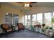 Cozy sunroom featuring wicker chairs and potted plants at 5375 Josephine Sw Ln, Concord, NC 28027