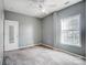 Bedroom with ceiling fan and window at 5435 Village Nw Dr, Concord, NC 28027