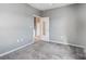 Grey bedroom with carpet and door to bathroom at 5435 Village Nw Dr, Concord, NC 28027