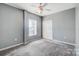 Simple bedroom with ceiling fan and window at 5435 Village Nw Dr, Concord, NC 28027