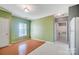 View of dining area with wood floor and access to bathroom at 5435 Village Nw Dr, Concord, NC 28027