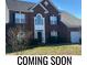 Two-story brick home with a large front yard at 5606 Ginger Ln, Indian Trail, NC 28079