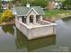 Stone gazebo situated on a community lake at 5606 Ginger Ln, Indian Trail, NC 28079