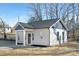 Charming newly built home with gray and beige exterior, covered porch and landscaping at 602 York Ave, Statesville, NC 28677