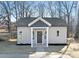 Newly constructed light beige house with dark gray accents and a welcoming front porch at 602 York Ave, Statesville, NC 28677