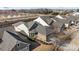 Overhead shot of several homes displaying the neighborhood's layout, with landscaping and roof details at 645 Honey Dew Ln, Fort Mill, SC 29715