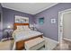 Bedroom with a queen bed, bench and hardwood flooring at 645 Honey Dew Ln, Fort Mill, SC 29715