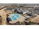 Aerial view of community pool, tennis courts, parking, and amenity center in a residential community at 645 Honey Dew Ln, Fort Mill, SC 29715