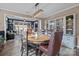 Bright dining room features a wood table, stylish light fixture, and built-in display cabinet at 645 Honey Dew Ln, Fort Mill, SC 29715