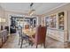 Elegant dining room with hardwood floors, modern lighting, and views into the adjacent living spaces at 645 Honey Dew Ln, Fort Mill, SC 29715