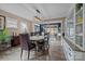 Well-lit dining room features wood flooring, a round wood table, and sliding door access to the yard at 645 Honey Dew Ln, Fort Mill, SC 29715