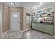 Inviting mudroom area with built-in storage, open shelving, and a stylish tiled floor, located near a door at 645 Honey Dew Ln, Fort Mill, SC 29715