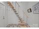 View of a modern floating staircase with metal cable railing at 645 Honey Dew Ln, Fort Mill, SC 29715