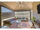 Inviting screened porch with vaulted ceiling, ceiling fan, and comfortable seating area at 645 Honey Dew Ln, Fort Mill, SC 29715