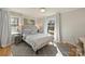 Bright bedroom featuring hardwood floors and ample natural light at 6511 Newhall Rd, Charlotte, NC 28270