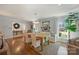 Bright dining room with hardwood floors, large windows and a chandelier at 6511 Newhall Rd, Charlotte, NC 28270