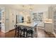 Modern kitchen with white cabinets, marble island, and stainless steel appliances at 6511 Newhall Rd, Charlotte, NC 28270