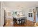 Open concept kitchen with white cabinets, marble island, and hardwood floors at 6511 Newhall Rd, Charlotte, NC 28270