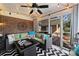 Cozy sunroom perfect for relaxing, featuring brick wall and comfy seating at 6511 Newhall Rd, Charlotte, NC 28270