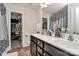 Bathroom with double vanity, walk-in shower, and large closet at 6908 Agava Ln, Charlotte, NC 28215