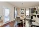 Dining room with hardwood floors and a table for six at 6908 Agava Ln, Charlotte, NC 28215