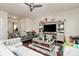 Living room with hardwood floors, sectional sofa, and entertainment center at 6908 Agava Ln, Charlotte, NC 28215