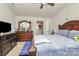 Main bedroom with a king-size bed and ensuite bathroom at 6908 Agava Ln, Charlotte, NC 28215