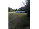 White mobile home with a large yard at 74 Noble Cir, Wadesboro, NC 28170