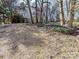 Backyard with trees and mulch at 7780 Orchard Park Cir, Harrisburg, NC 28075