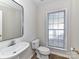 Small bathroom with single vanity and window at 7780 Orchard Park Cir, Harrisburg, NC 28075