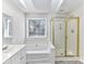 Bathroom with soaking tub, shower, and vanity at 7780 Orchard Park Cir, Harrisburg, NC 28075