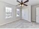 Bedroom with ceiling fan and double door closet at 7780 Orchard Park Cir, Harrisburg, NC 28075