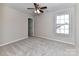 Bedroom with ceiling fan and window at 7780 Orchard Park Cir, Harrisburg, NC 28075